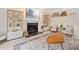 Spacious living room boasting a fireplace, decorative rug, and built-in shelving at 2166 Carlyle Dr, Marietta, GA 30062