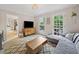 Cozy living room with a comfortable sofa, TV, and access to the deck with backyard views at 2166 Carlyle Dr, Marietta, GA 30062