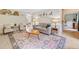 Cozy living room featuring a decorative rug, comfortable seating, and neutral color palette at 2166 Carlyle Dr, Marietta, GA 30062