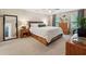 Bright bedroom with wood furnishings, neutral tones, and ample natural light at 2166 Carlyle Dr, Marietta, GA 30062