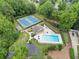 Aerial shot of a large community swimming pool, tennis courts, and ample seating areas at 2166 Carlyle Dr, Marietta, GA 30062
