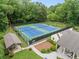 Overhead shot of two tennis courts, a covered seating area and a community pool at 2166 Carlyle Dr, Marietta, GA 30062