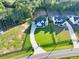 Aerial view of a beautifully landscaped home with a long driveway and lush green lawn at 2381 Jones Phillips Rd, Dacula, GA 30019