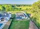 Aerial view of a home with a well-maintained lawn and an adjacent property with a pool at 2381 Jones Phillips Rd, Dacula, GA 30019