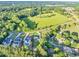 Stunning aerial view of luxury homes on spacious lots with mature trees and well-manicured lawns in a rural setting at 2381 Jones Phillips Rd, Dacula, GA 30019