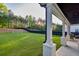 A large backyard with lush green grass and mature trees at 2381 Jones Phillips Rd, Dacula, GA 30019