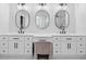Modern bathroom featuring dual vanities, marble countertops, and black hardware at 2381 Jones Phillips Rd, Dacula, GA 30019