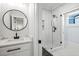 Modern bathroom with a glass shower and a marble vanity at 2381 Jones Phillips Rd, Dacula, GA 30019
