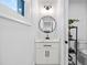 Bathroom showcasing a vanity with marble top and a shelf with decor at 2381 Jones Phillips Rd, Dacula, GA 30019