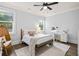 Bedroom featuring two large windows, a bed, and decor at 2381 Jones Phillips Rd, Dacula, GA 30019