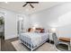 Bright bedroom showing bed, desk, and an ensuite bath at 2381 Jones Phillips Rd, Dacula, GA 30019