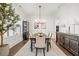 Dining room featuring a dining table, stylish chandelier and a decorative cabinet at 2381 Jones Phillips Rd, Dacula, GA 30019