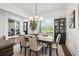 Dining room featuring a dining table, stylish chandelier and a decorative cabinet at 2381 Jones Phillips Rd, Dacula, GA 30019