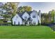 A sprawling front yard and mature trees highlight this beautiful home at 2381 Jones Phillips Rd, Dacula, GA 30019