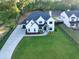 Charming two-story home with a well-maintained lawn and professional landscaping, adding to its curb appeal at 2381 Jones Phillips Rd, Dacula, GA 30019