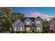 Stunning two-story painted brick home showcasing a symmetrical design and welcoming front entrance at 2381 Jones Phillips Rd, Dacula, GA 30019