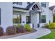 Charming front porch with stone pillars and stylish decor at 2381 Jones Phillips Rd, Dacula, GA 30019