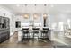 Stylish kitchen featuring an island, modern lighting, stainless steel appliances, and seating at 2381 Jones Phillips Rd, Dacula, GA 30019