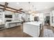 Spacious open-concept layout combining kitchen, living, and dining areas, with hardwood floors at 2381 Jones Phillips Rd, Dacula, GA 30019