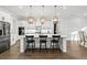 Modern kitchen featuring an island with bar seating, stainless steel appliances, and pendant lighting at 2381 Jones Phillips Rd, Dacula, GA 30019