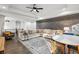Bright living room with modern decor, a large sectional sofa, and hardwood floors at 2381 Jones Phillips Rd, Dacula, GA 30019