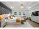 Spacious main bedroom with accent wall, tray ceiling, and hardwood floors throughout at 2381 Jones Phillips Rd, Dacula, GA 30019