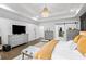 Charming main bedroom with hardwood floors, gray dressers, and bright decor at 2381 Jones Phillips Rd, Dacula, GA 30019