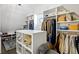 Organized walk-in closet with custom shelving, hanging racks, and ample storage space at 2381 Jones Phillips Rd, Dacula, GA 30019