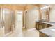 Bathroom featuring a glass shower, vanity with sink, and tiled flooring, showcasing modern amenities at 245 Ashley Forest Dr, Fayetteville, GA 30214