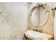 Powder room featuring ornate mirror and a decorative vanity with a vessel sink at 245 Ashley Forest Dr, Fayetteville, GA 30214