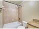Cozy bathroom featuring a tub with shower, toilet, and a granite-topped vanity at 245 Ashley Forest Dr, Fayetteville, GA 30214