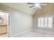 Bedroom with neutral color, ceiling fan, carpet and window with white shutters leading to a bathroom at 245 Ashley Forest Dr, Fayetteville, GA 30214