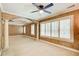 Spacious bedroom features decorative columns, tray ceiling, neutral carpet and natural light from the shuttered windows at 245 Ashley Forest Dr, Fayetteville, GA 30214