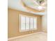 Bedroom featuring neutral carpet, a ceiling fan and natural light from shuttered windows at 245 Ashley Forest Dr, Fayetteville, GA 30214