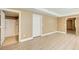 Light-filled bedroom with wood-look flooring and access to a full bathroom with a tiled shower at 245 Ashley Forest Dr, Fayetteville, GA 30214