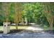 Image of a driveway with view of the home, mailbox, and surrounding mature trees at 245 Ashley Forest Dr, Fayetteville, GA 30214