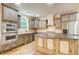 Kitchen with a center island, stainless steel appliances, and lots of cabinet space at 245 Ashley Forest Dr, Fayetteville, GA 30214