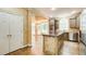 Kitchen with an island, stainless steel appliances, and view into the eating area at 245 Ashley Forest Dr, Fayetteville, GA 30214