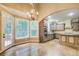 Eat-in kitchen area with a chandelier, stainless steel appliances, and a door to the deck at 245 Ashley Forest Dr, Fayetteville, GA 30214