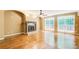 Bright and airy living room with hardwood floors, a fireplace, large windows, and access to the outdoor deck at 245 Ashley Forest Dr, Fayetteville, GA 30214