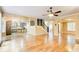 Open concept living room featuring hardwood floors and views into the kitchen at 245 Ashley Forest Dr, Fayetteville, GA 30214
