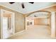 Spacious main bedroom showcasing architectural archways, decorative columns, and plush carpeting at 245 Ashley Forest Dr, Fayetteville, GA 30214