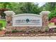 Stone sign reading 'Ashley Forest' surrounded by manicured landscaping and colorful flowers at 245 Ashley Forest Dr, Fayetteville, GA 30214