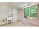 Unfinished utility room with a utility sink, water softener, and double-hung windows at 245 Ashley Forest Dr, Fayetteville, GA 30214