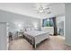 Bright bedroom featuring neutral walls, a ceiling fan, and multiple dressers at 755 Waterbrook Ter, Roswell, GA 30076