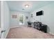 Bright bedroom featuring neutral walls, a ceiling light, and a desk at 755 Waterbrook Ter, Roswell, GA 30076