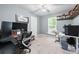 Bedroom featuring a ceiling fan, gray walls, and a desk with multiple monitors at 755 Waterbrook Ter, Roswell, GA 30076