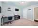 Cozy bedroom featuring neutral walls, a ceiling light, and a desk at 755 Waterbrook Ter, Roswell, GA 30076