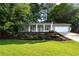 Charming single-story home with well-manicured lawn and rock garden at 755 Waterbrook Ter, Roswell, GA 30076