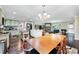 Open concept kitchen with an island, and direct views to living room at 755 Waterbrook Ter, Roswell, GA 30076